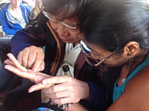 Muang giving Nina a hand.